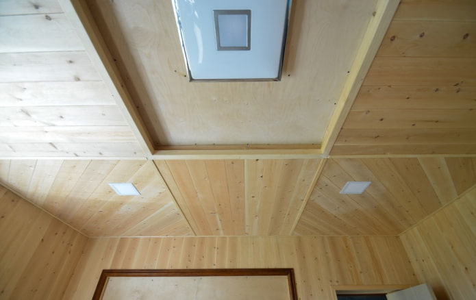 two-level ceiling structure sheathed with clapboard