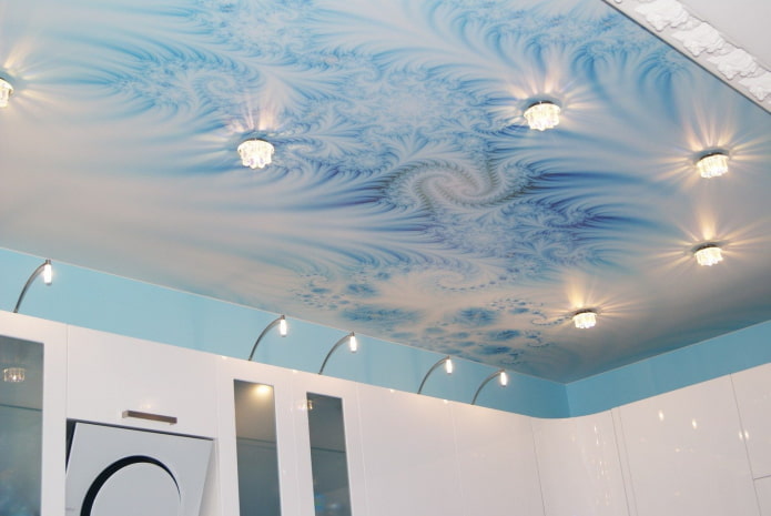 blue and white ceiling structure with spotlights
