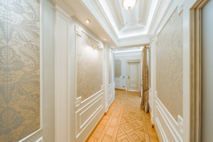 moldings on the walls in the hallway