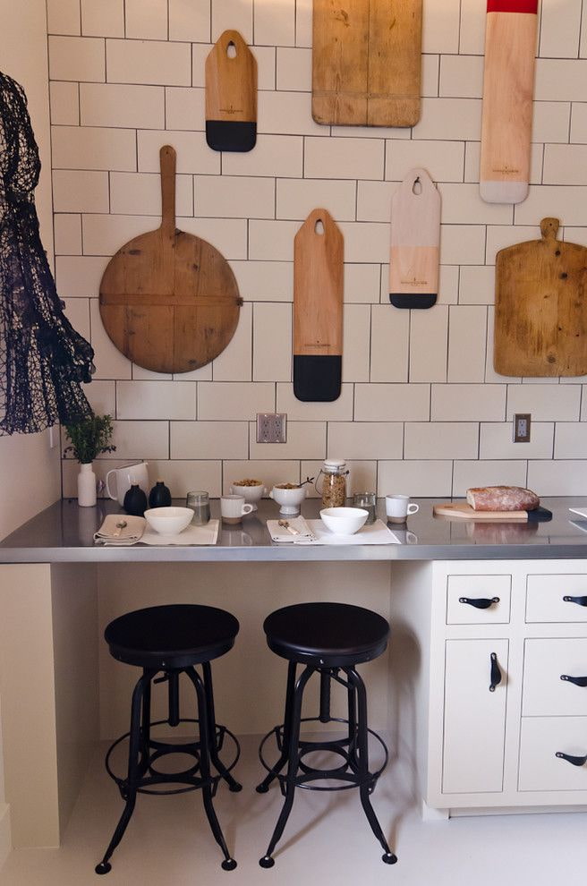 cutting boards on the wall in the kitchen