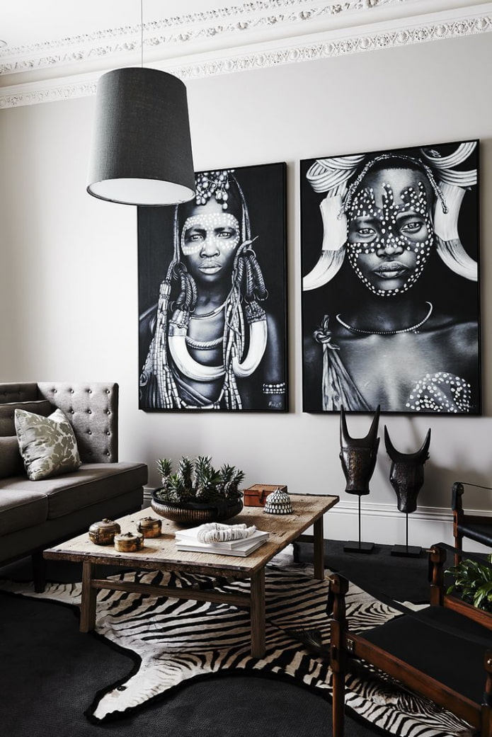 black and white paintings on the wall in the living room