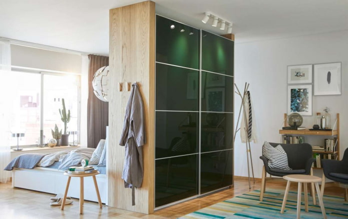 sliding wardrobe in the form of a partition in the interior