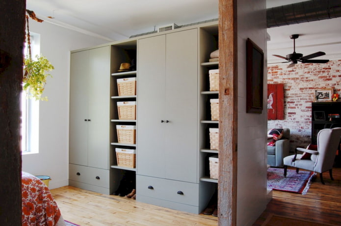 wardrobe in the form of a partition in a loft-style interior