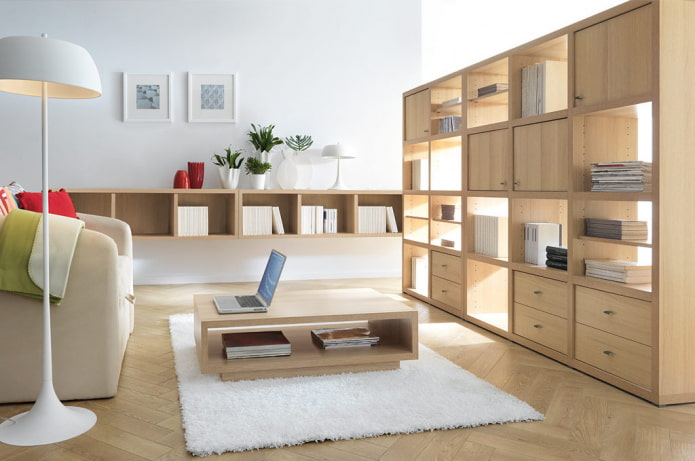 partition in the form of a beige shelving in the interior