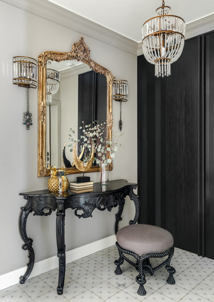 mirror in a forged frame in the interior of the hallway