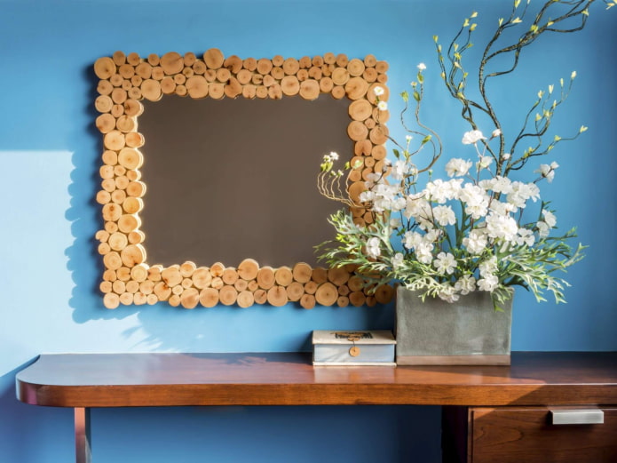 mirror decorated with wooden saw cuts