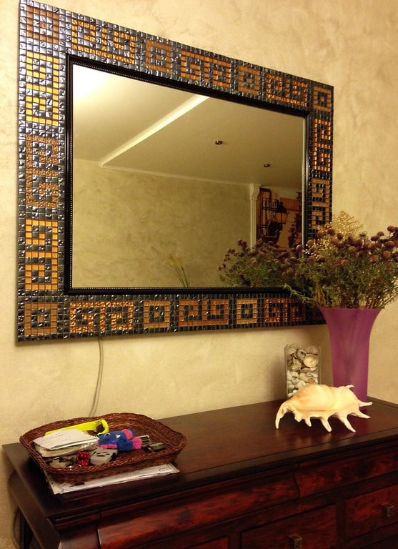 mirror in a mosaic frame in the interior