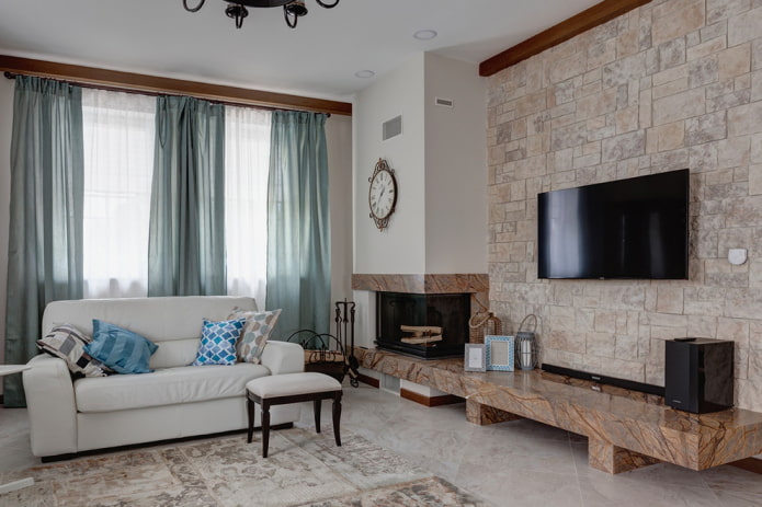 fireplace under the TV with an offset in the interior