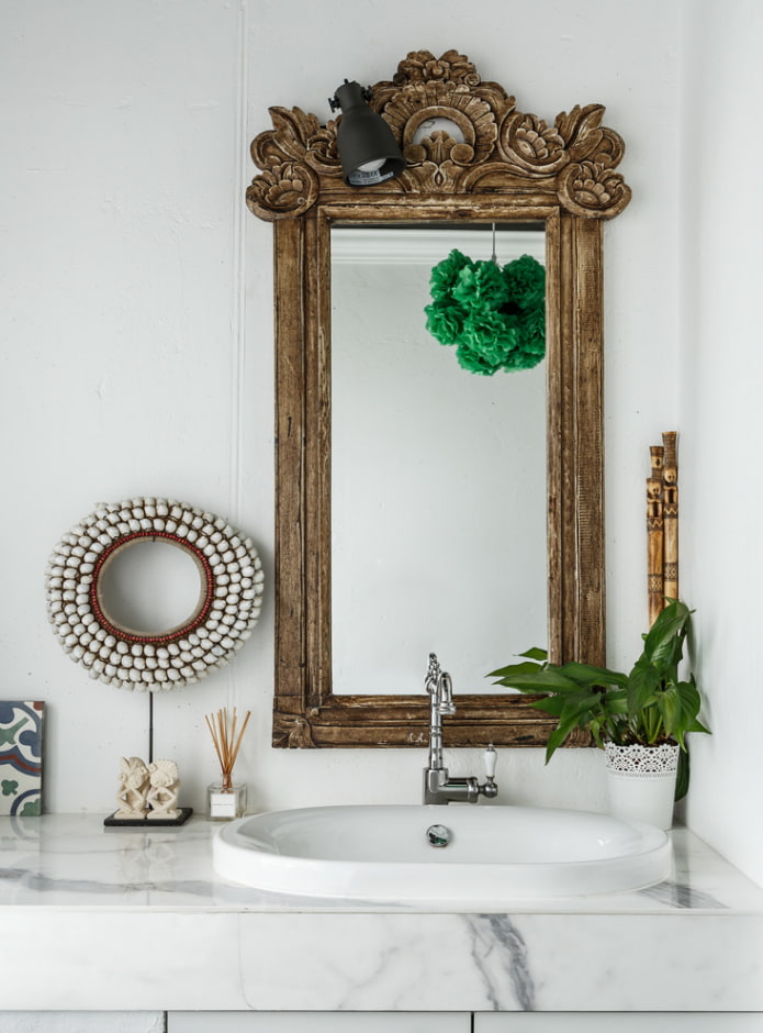 mirror in a wooden frame in the interior