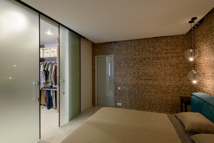 dressing room with sliding doors in the interior of the bedroom