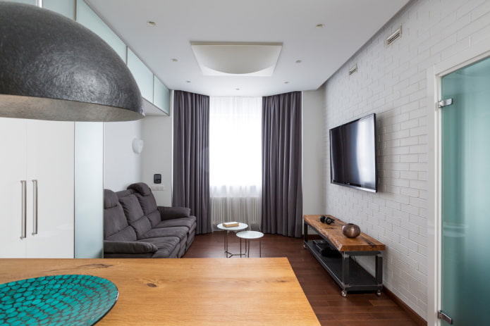 wall-mounted TV in the interior in a modern style
