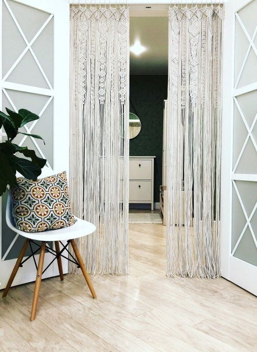 curtains in macrame technique on the door in the interior