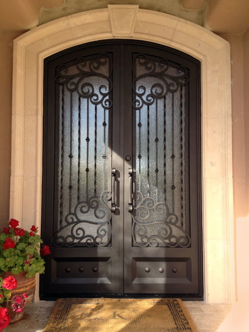 front door with wrought iron and glass