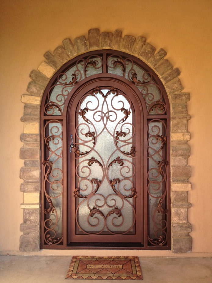 metal entrance door with forged patterns