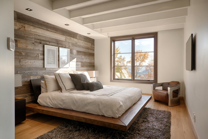 low wooden bed in the interior