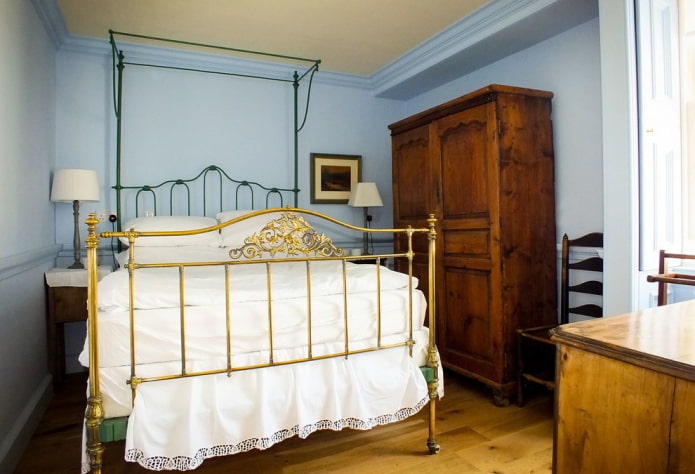 bed with golden wrought iron