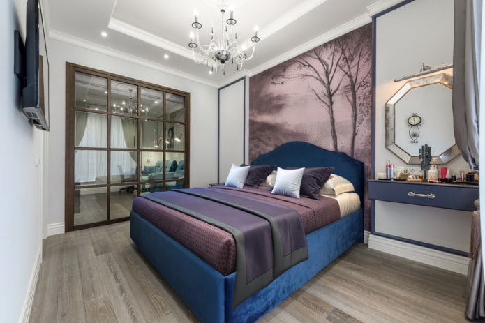 bed with a blue headboard in the interior
