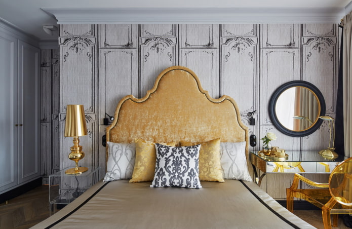 bed with a curly headboard in the interior