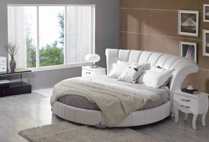 bed with a curved headboard in the interior