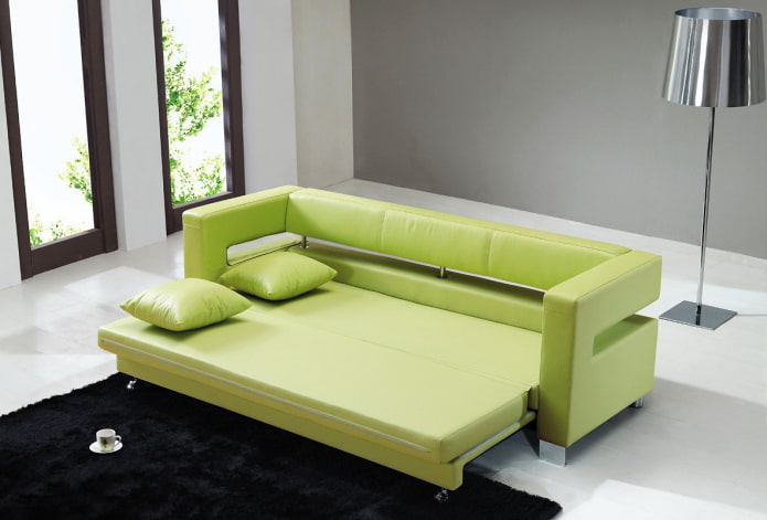 green folding sofa in the interior
