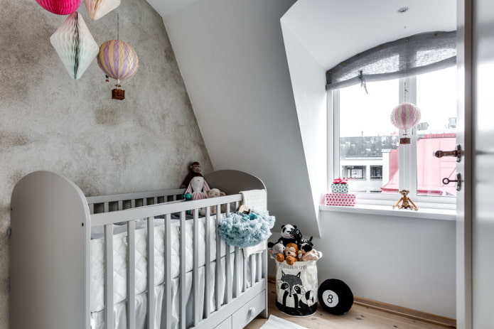 gray crib for baby in the interior