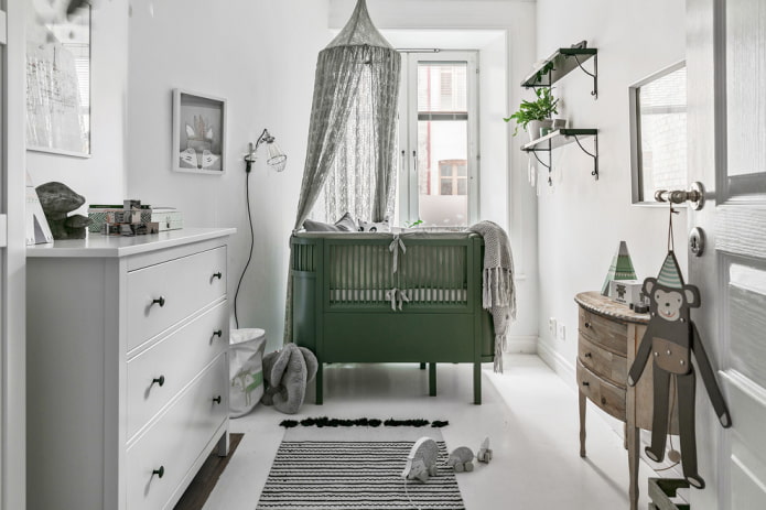 green crib for baby in the interior