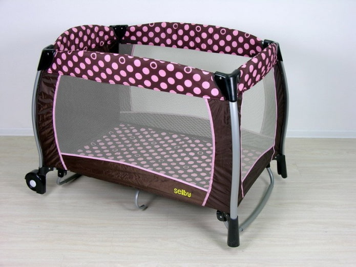 crib playpen for a newborn in the interior