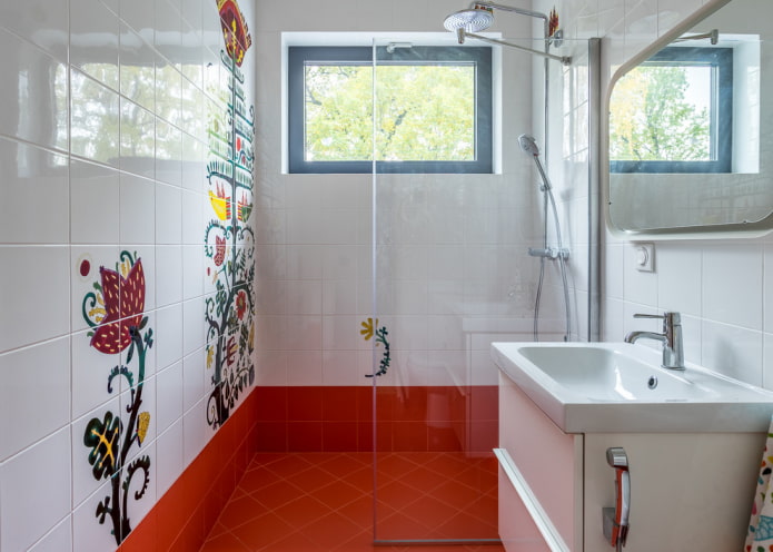 white tiles with drawings in the bathroom interior