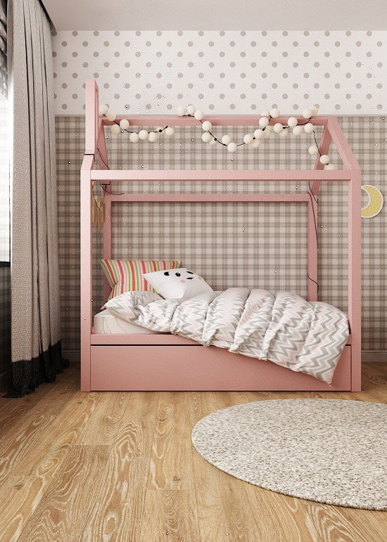 pink bed in the form of a house in the nursery