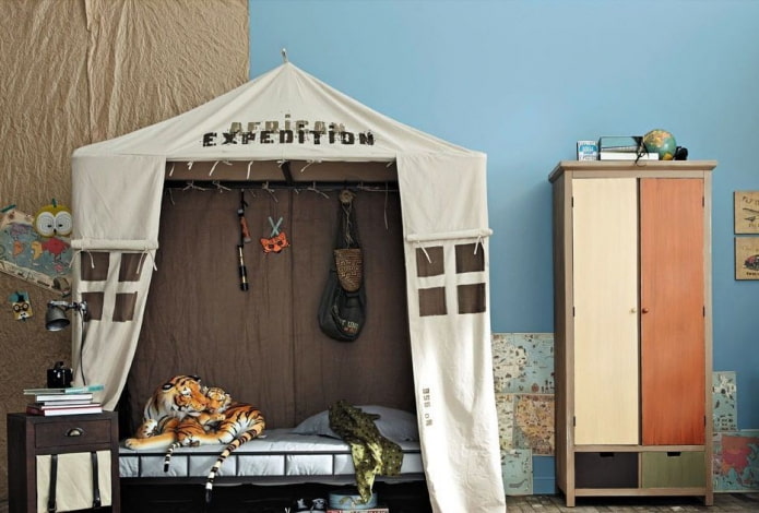 bed in the form of a tent in the nursery for a boy