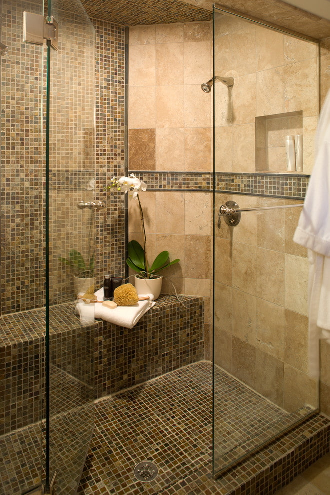 shower room with a seat made of tiles in the interior