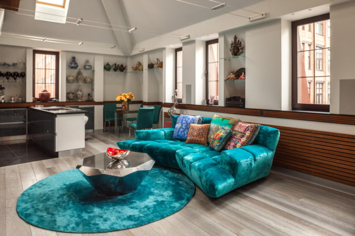 sofa with fabric upholstery in turquoise color in the interior