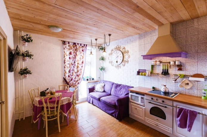 compact sofa in purple tones in the kitchen