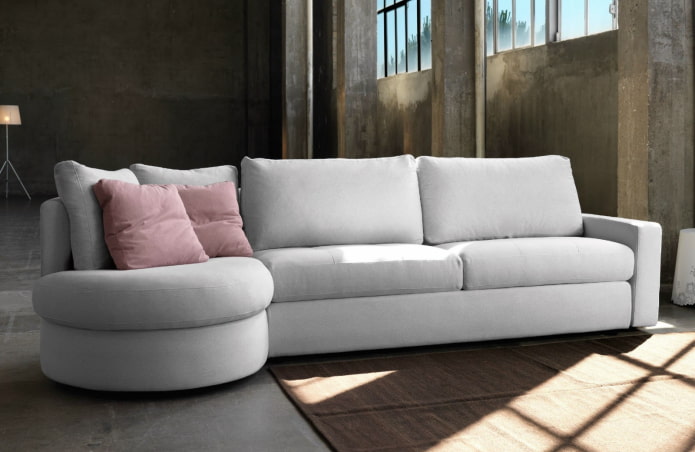 modelo ng sofa na may puting ottoman sa interior
