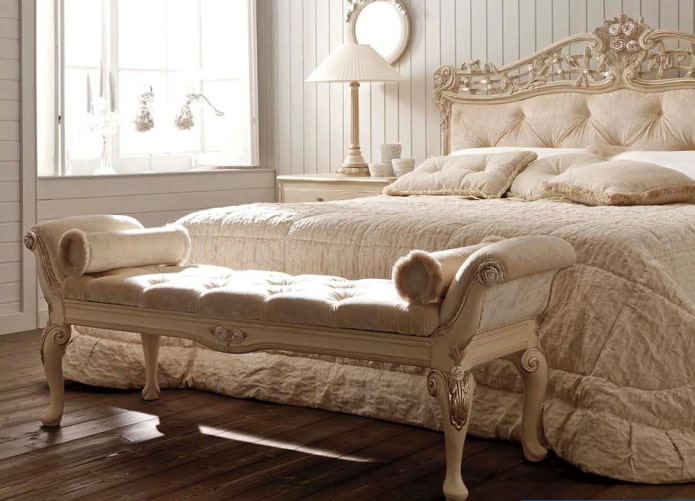 ottoman near the bed in the interior
