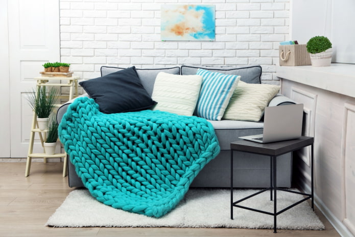 knitted cover for the sofa in the interior