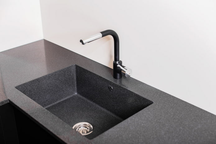 black sink made of artificial stone in the interior