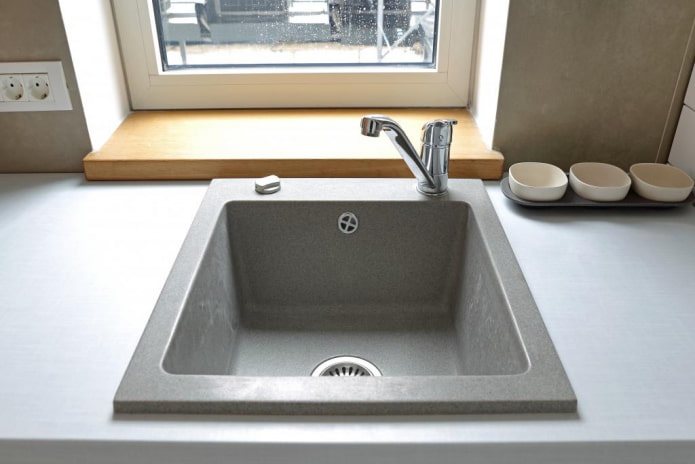 gray sink made of artificial stone in the interior