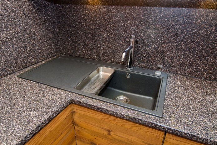 sink made of artificial stone in the interior of the kitchen