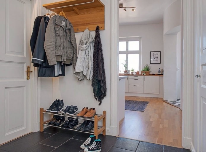 shoe rack in the interior of the hallway in the Scandinavian style