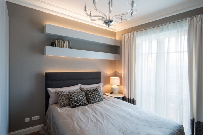 shelves above the bed in the interior of the bedroom
