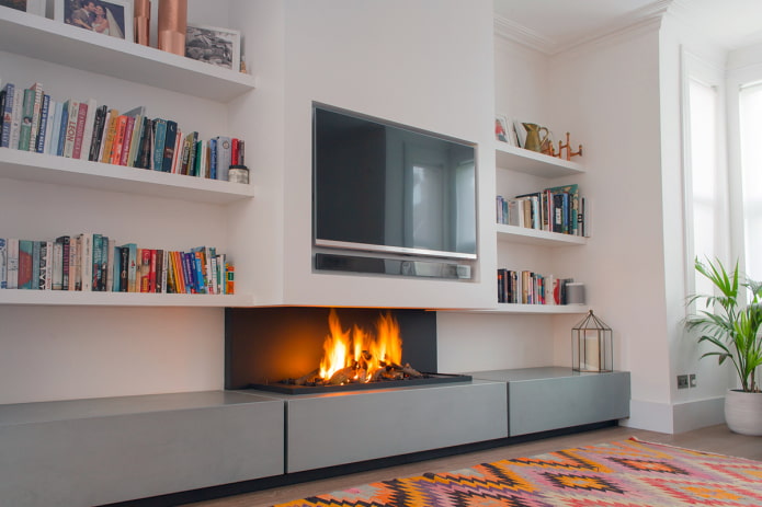 bookshelves above the fireplace in the interior