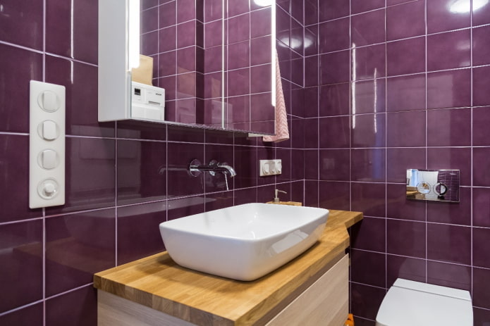 wooden furniture on a background of purple tiles