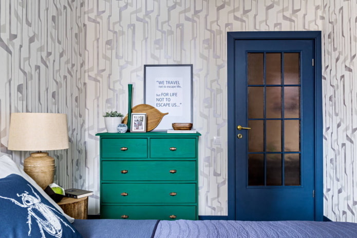 Green chest of drawers and blue door