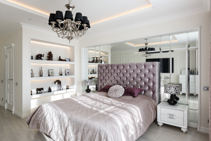 Bedroom with mirrored headboard