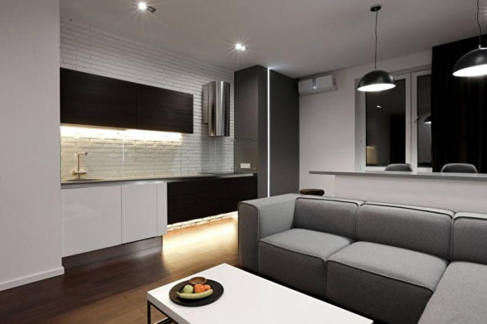 Wohnzimmer mit Küche und Sofa