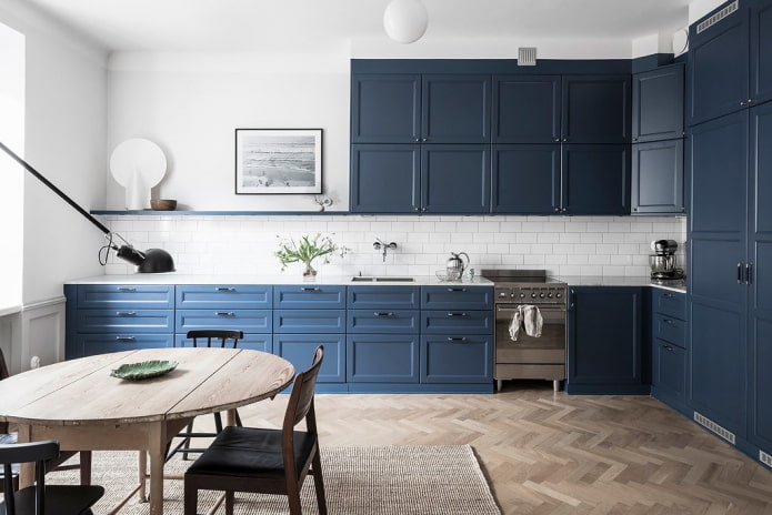 household appliances in the interior of the kitchen in blue tones