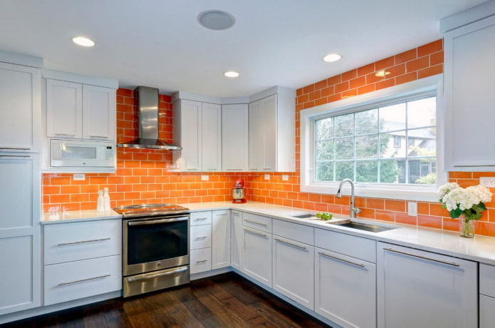 kitchen interior in orange and white tones