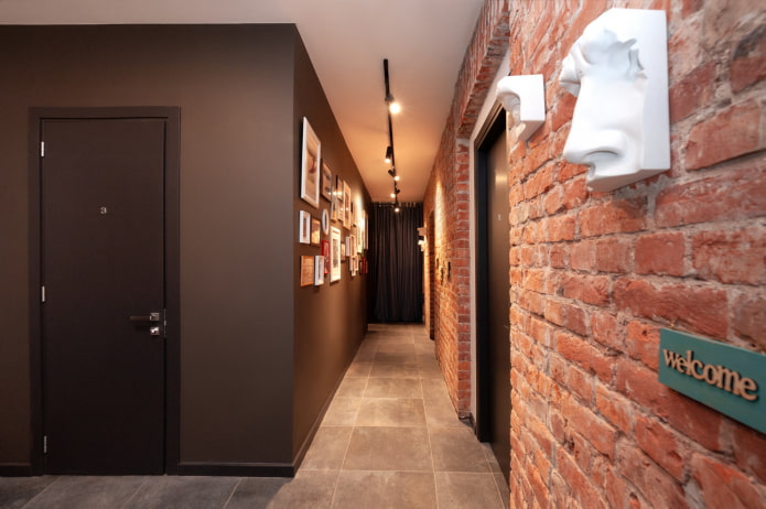 hallway with a brick wall in an industrial style