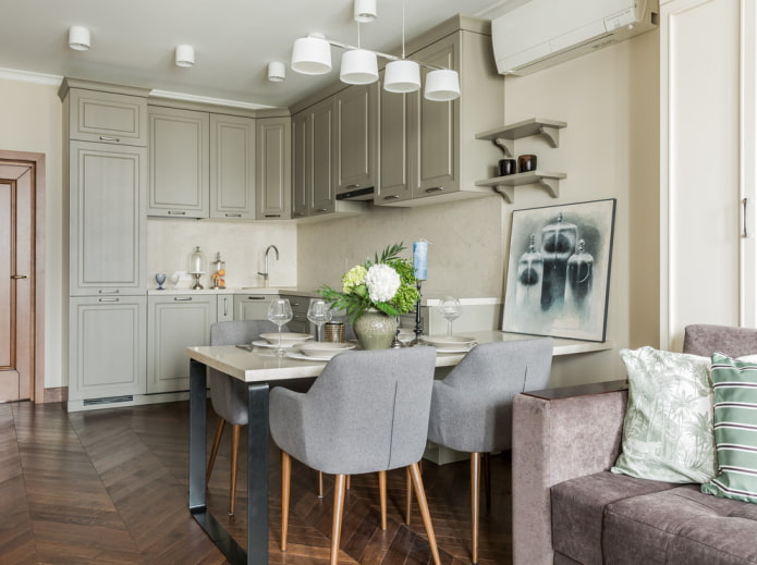 Elegant kitchen-living room with upholstered furniture